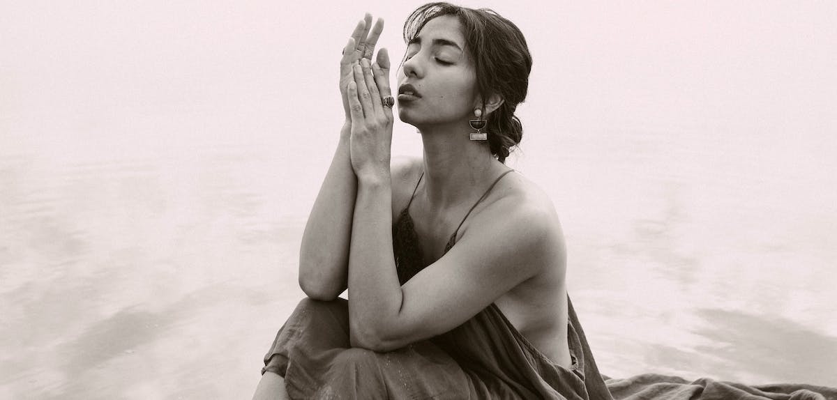 Woman in water at peace with self